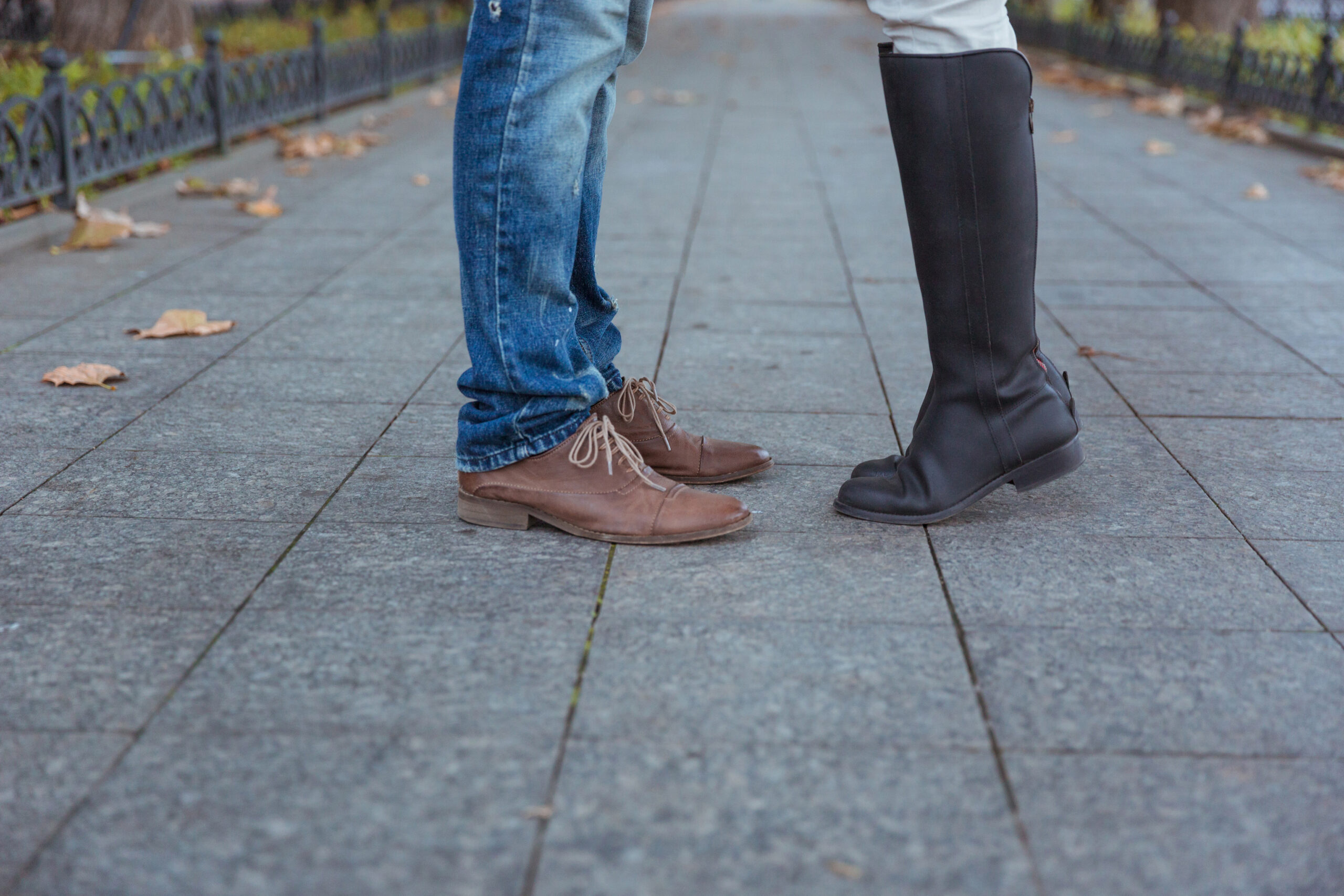 closeup portrait of a mans and womans legs during a date HFqzrxE0Bo scaled