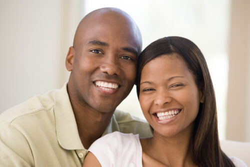 couple in living room smiling rt1 e6qCBj